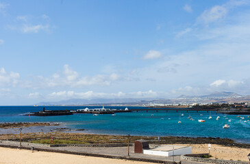 Obraz premium Arrecife port city view - capital of Lanzarote, Canary Islands. Cityscape of Arrecife on sunny day horizontal landscape background.