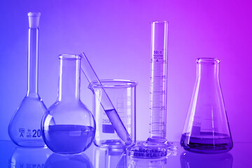 Laboratory Research concept. Scientific laboratory glassware with colourful liquid.