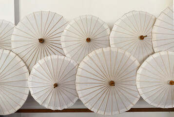 Thai white color umbrellas craft hand made, drying in  an umbrella factory, Thailand, Chiang Mai.