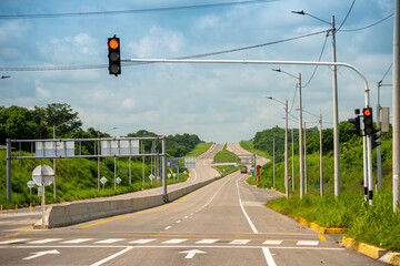 Traffic light on a Colombian highway in a hot climate. Colombia.