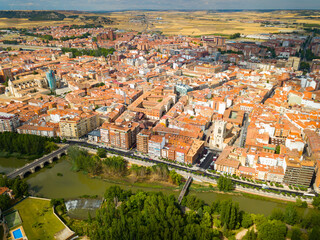 Fototapeta na wymiar Aerial view of Palencia cityscape overlooking ancient Gothic building of Catholic Cathedral, Spain..