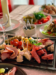 table setting with appetizers, plates, glasses