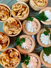 tartlets close-up, table setting with appetizers