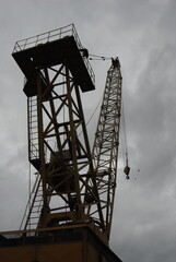 Fototapeta na wymiar Yellow crane in the port