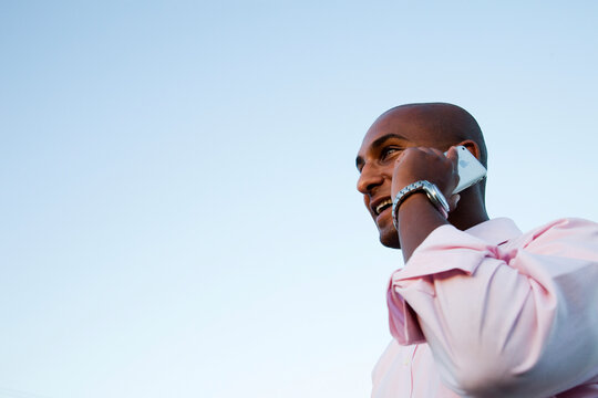 A Young Ethiopian Man Holds His Cellular Phone To His Ear.