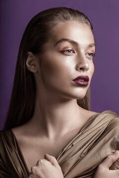 Fashion beauty portrait of young woman in studio