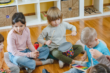 Preschool children with instruments in a music class