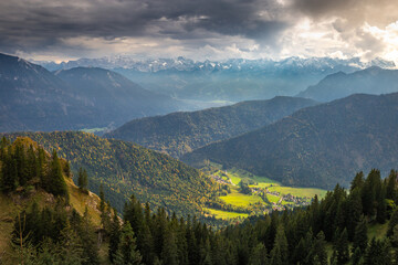 Obraz premium Bavarian alps and valleys from above at dramatic autumn sky, Garmisch, Germany