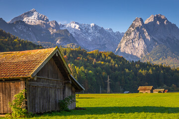 Bavarian alps and rustic farm barn, Garmisch, Zugspitze massif, Bavaria, Germany