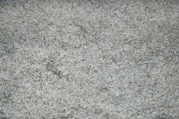 background of white rice grains on table