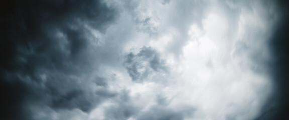 Dramatic cloudscape texture. Dark heavy thunderstorm clouds before rain. Overcast rainy bad weather. Storm warning. Natural gray background of cumulonimbus. Nature backdrop of stormy cloudy sky.
