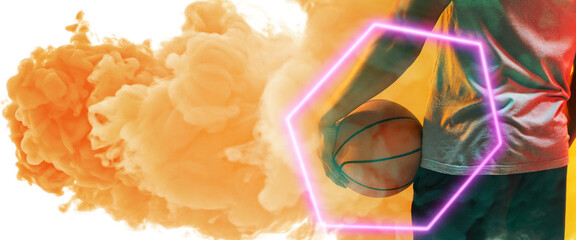 Midsection of biracial basketball player holding ball with hexagon over smoky background - Powered by Adobe