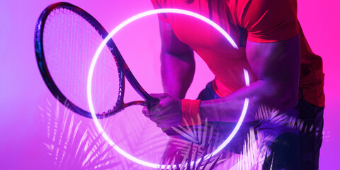 Illuminated plants and circle over midsection of african american male tennis player with racket