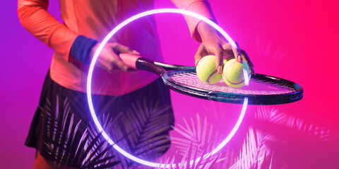 Illuminated circle and plant over midsection of african american female player with racket and balls