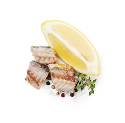 Delicious canned mackerel chunks with thyme, lemon and spices on white background, top view