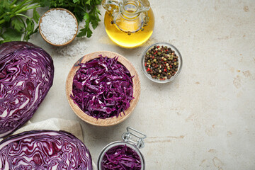 Tasty red cabbage sauerkraut and different ingredients on table, flat lay. Space for text
