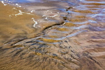 Creative beach sand with small stones