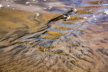 Creative beach sand with small stones