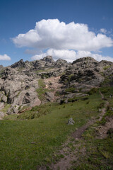 Hiking in the rock massif Los Gigantes in Cordoba, Argentina. View of the trail and rocky hill in a sunny day.  