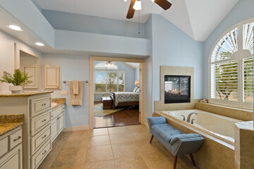 Master bathroom with a fireplace