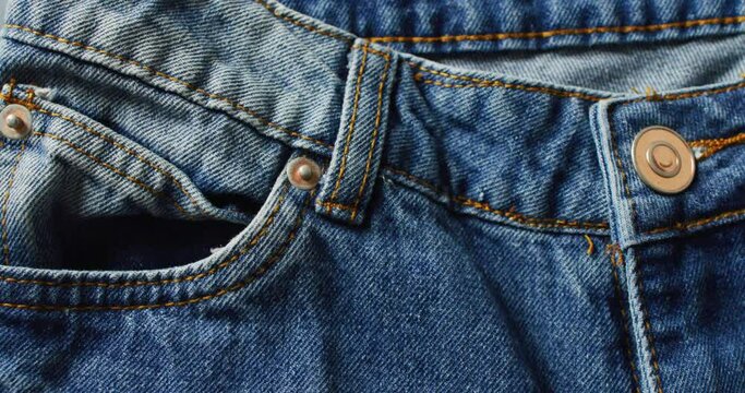 Close up of jeans on grey background with copy space