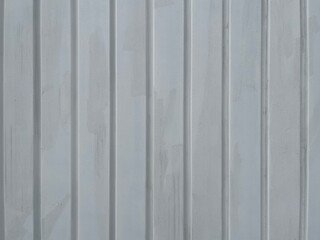 wall structure of aligned parallel timbers painted white