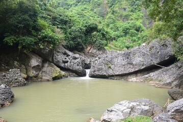 Naklejka na ściany i meble Mountain lake with small waterfall in Saguling district Bandung, West Java, Indonesia