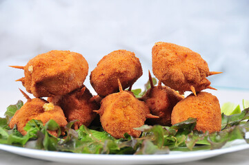 chicken Kiev chicken fillet stuffed with cheese and fried with salad and sauce