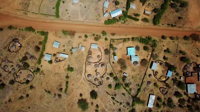 Panoramic aerial view of an area of Karamoja, Uganda where there are traditional houses of the region. High quality 4k footage