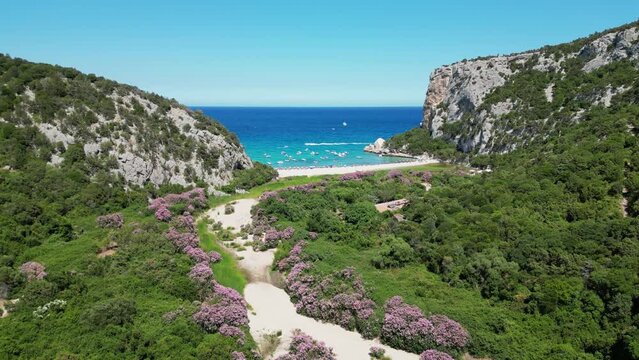 Cala Luna Beach at Baunei Coast of Sardinia, Italy - Aerial 4k Pedestal Up