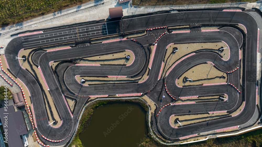 Wall mural Aerial top view race kart track, Track for auto racing top view, Car race asphalt and curve grand prix street circuit, Aerial view asphalt race track. - Wall murals