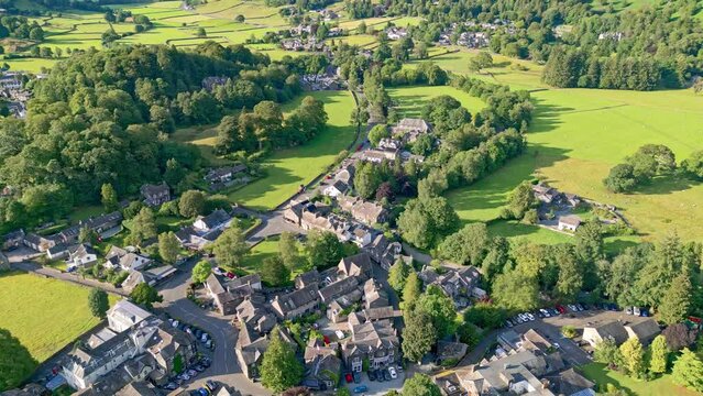 Cinematic aerial view of the Lakeland town of Grasmere. Showing the small lakeland town. English Lake District National Park, Cumbria. UK