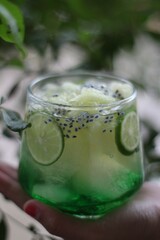 Es kuwut, a traditional Balinese drink made from melon fruit syrup and basil seeds