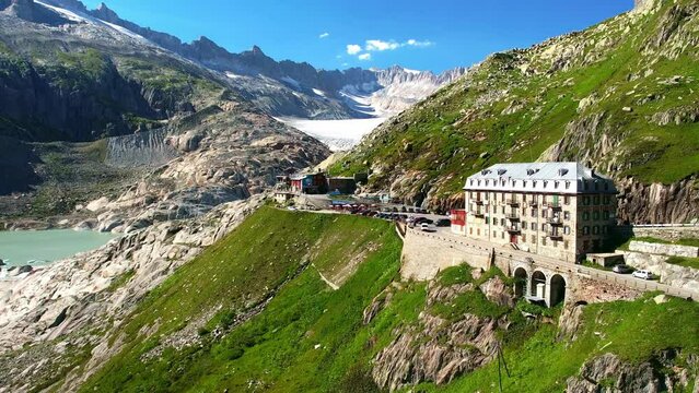 Drone Switzerland 4k. mountain pass winding roads in Swiss Alps. Switzerland summer Furka Pass road trip, tourism destination.