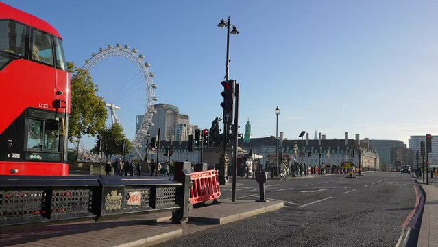 City center of London near the Big Ben and Westminster Bridge with red double decker busses crossing London, England, United Kingdom.