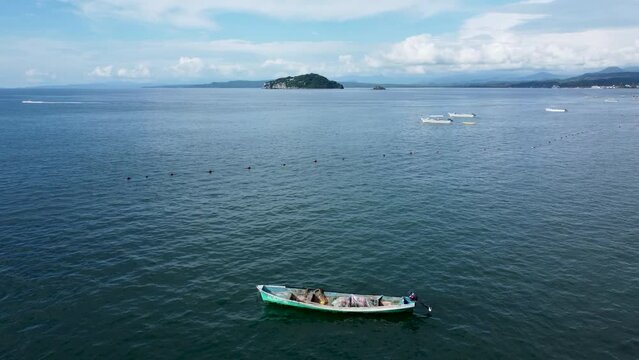 calm boat aerial shot in guayabitos beach