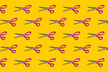 Rows of pink scissors on a bright yellow background