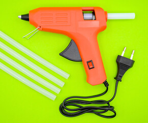 glue gun with plastic glue sticks close-up