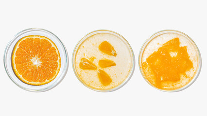 Petri dishes with orange research. Cut orange, research in the laboratory. Bioengineering,...