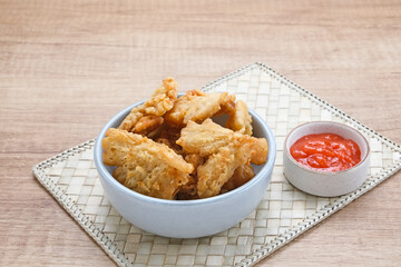 Crispy Fried Oyster Mushroom or Jamur Krispi served with chilli sauce, Indonesian snack
