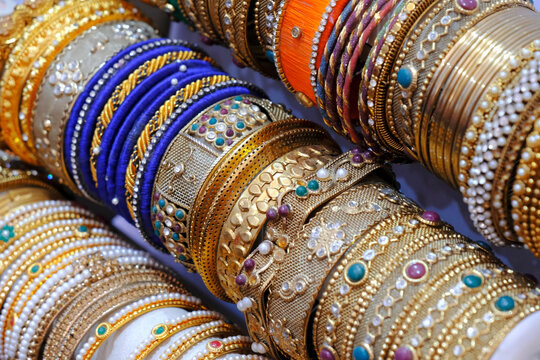 Indian colorful bangles displayed in local shop in a market of Pune, India, These bangles are made of Glass used as beauty accessories by Indian women, Selective focus.