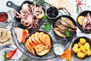 Various of seafood platter - prawn shrimp, squid, octopus mini, salmon, lobster.