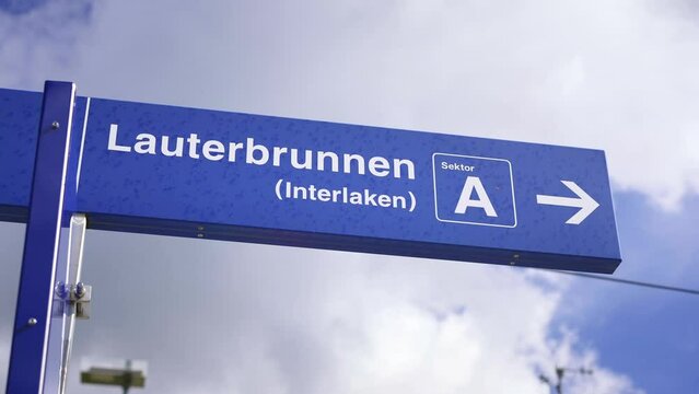 Lauterbrunnen sign at Kleine Scheidegg train station. Tourist destination to Jungfraujoch, Interlaken and Grindelwald. Bernese Oberland, Switzerland. Swiss Alps in summer