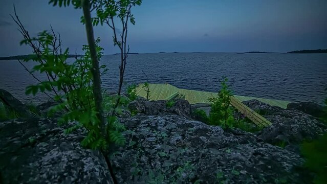 New built deck on the water. Cinematic time lapse shot of a lake.