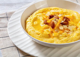 corn grits with butter, vegan cheese, and almonds