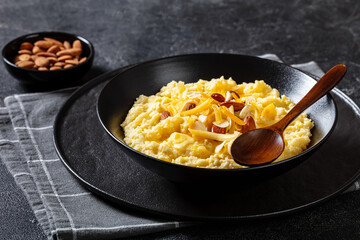 corn grits with butter, vegan cheese, and almonds