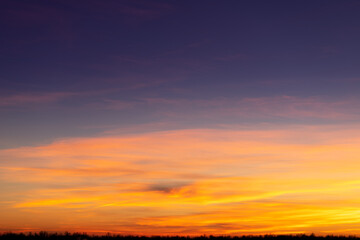 Obraz na płótnie Canvas Sunset sky with pink and gray clouds