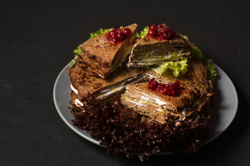 Liver cake with mayonnaise, mustard and lingonberry sauce