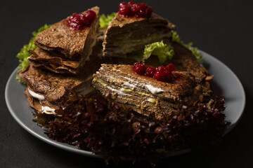 Liver cake with mayonnaise, mustard and lingonberry sauce