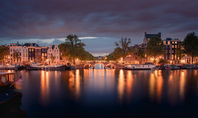 Amsterdam Canals with bridge and dutch houses, Netherlands